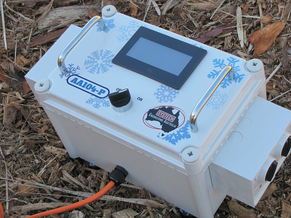 A small electronic device is sitting on the ground, with UV inkjet print on it.