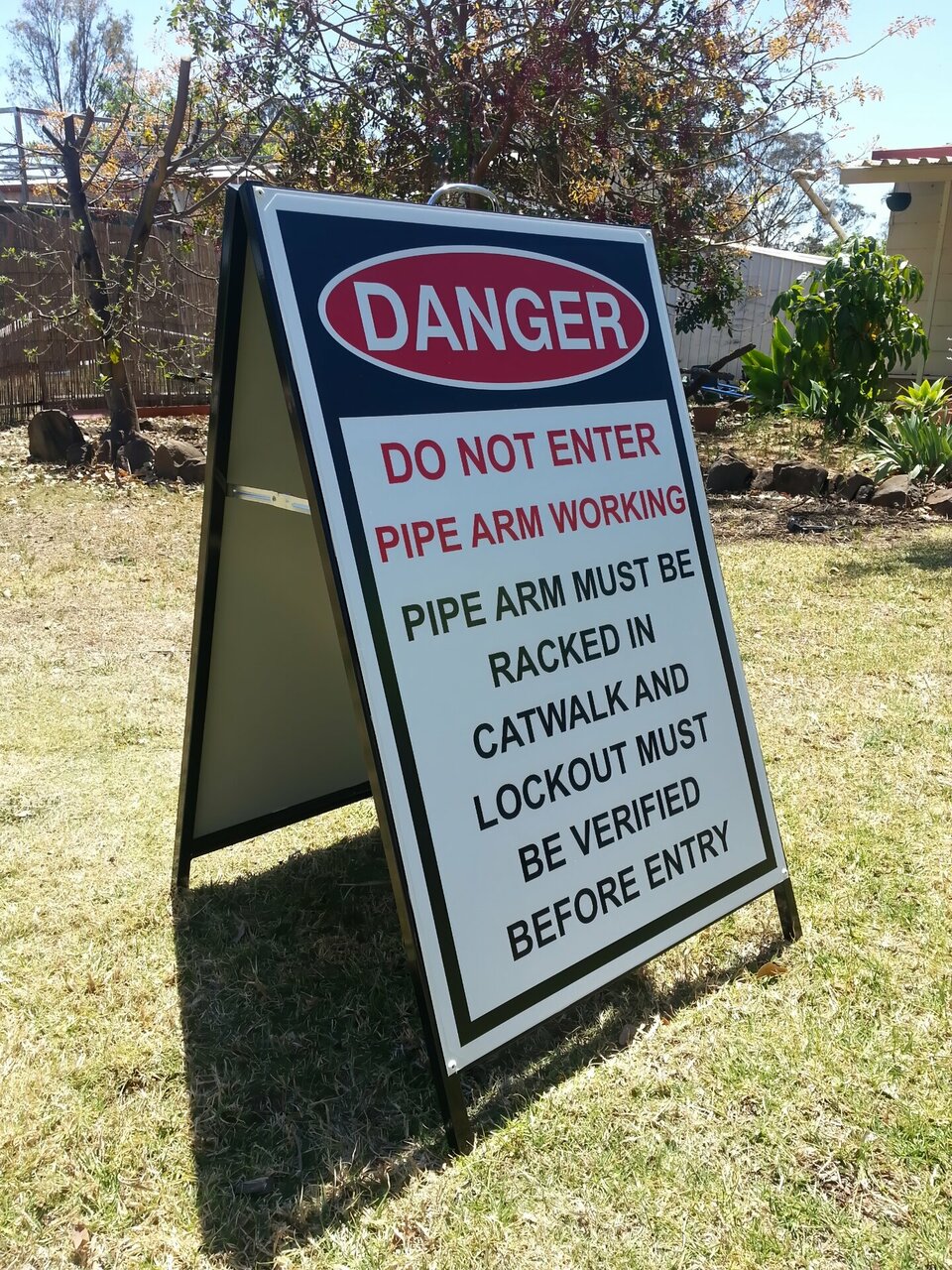 A-frame sandwich board with danger notice.